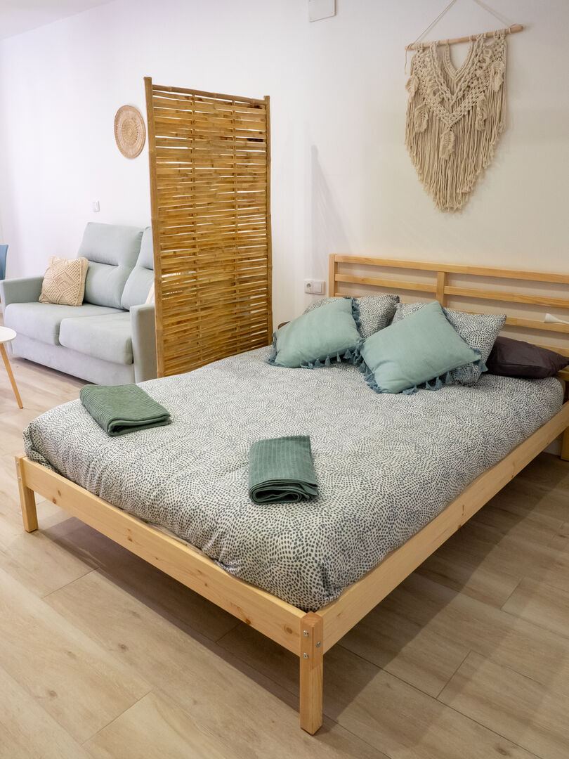 Double bed with bamboo screen