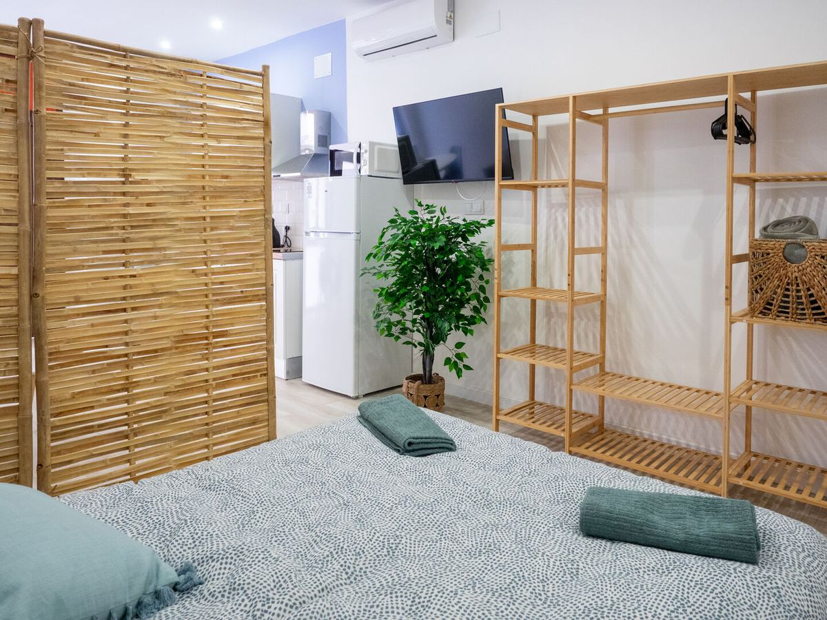 Double bed with bamboo screen